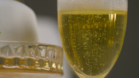 Close-Up-Of-Champagne-In-Glass-At-Table-Set-For-Meal-At-Wedding-Reception